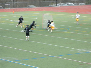 Andover's Brendan Croston puts a shot on the NA net. [Photo: Mike Abelson]